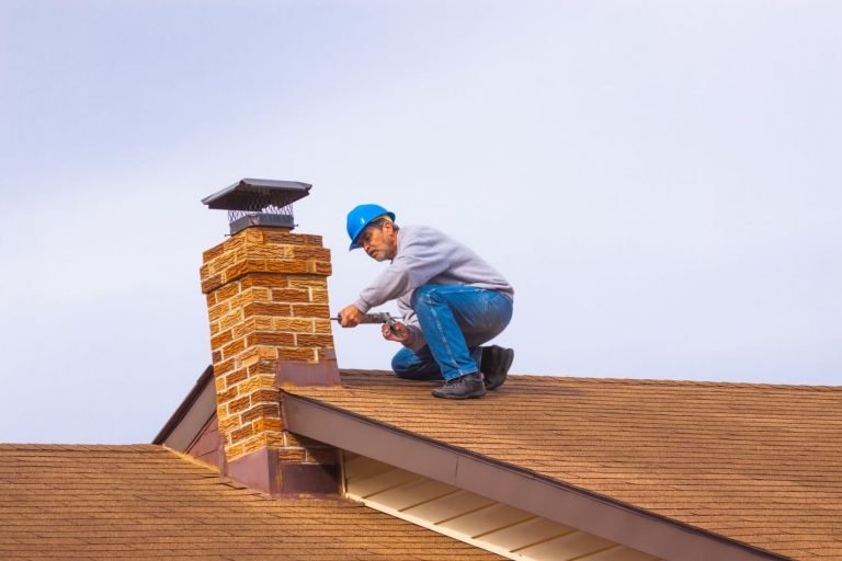 Mason Completing Brick Chimney Repair