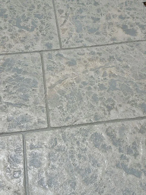 close up stamped concrete gray tile pattern stamped concrete floor