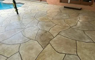 Resurfaced pool deck dynamic and layered geometric design