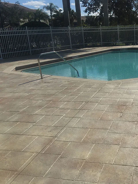 stamped concrete pool deck travertine pattern beige Stamped Concrete