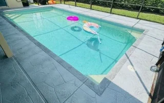 screened pool deck with floaties
