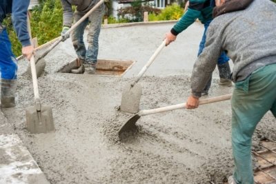 workers working on driveway resurfacing