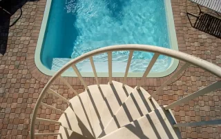 Pebble Stone Pool Deck vs. Stamped Concrete