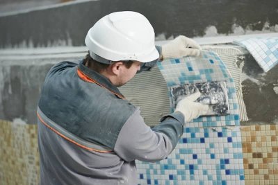 man working pool resurfacing